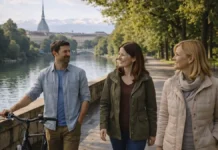 Парки Турина: полный гид по зелёным местам города и окрестностей Парки Турина - прогулки у реки По и панорамы города зелёный парк в Турине, дорожка для прогулки, мягкий дневной свет, вид на город и Альпы вдали.