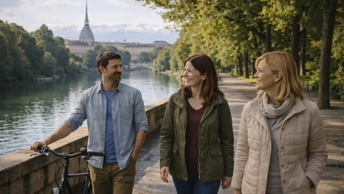 Парки Турина - прогулки у реки По и панорамы города зелёный парк в Турине, дорожка для прогулки, мягкий дневной свет, вид на город и Альпы вдали.