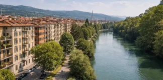 Район Regio Parco в Турине: жизнь, безопасность и цены на жильё Район Regio Parco в Турине вид с высоты – дома, река По и зелёные зоны Панорамный вид на район Regio Parco в Турине с высоты: на переднем плане жилые дома и зелёные дворы, на заднем плане река По и набережная, мягкий дневной свет