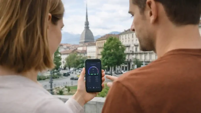 5G и 4G интернет в Турине: покрытие и скорость связи Современный городской сюжет без текста: человек проверяет скорость мобильного интернета на смартфоне на фоне улицы Турина