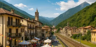 От дачников до жителей: почему Ceres в Пьемонте выбирают для жизни рядом с Турином Жизнь в Ceres Пьемонт рядом с Турином Фотореалистичный вид Ceres в долине Валь-ди-Ланцо, горы, домики и железная дорога в сторону Турина, солнечная атмосфера.