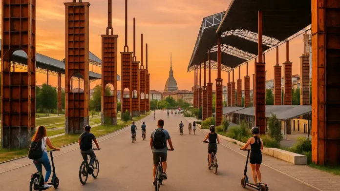 torino-design-parco-dora-ogr-lingotto Вечерний Турин. Металлические колонны Parco Dora и силуэт Моле Антонеллиана на горизонте Пространство Parco Dora с оранжевыми стойками бывших навесов, прогулочная зона, на горизонте городские крыши